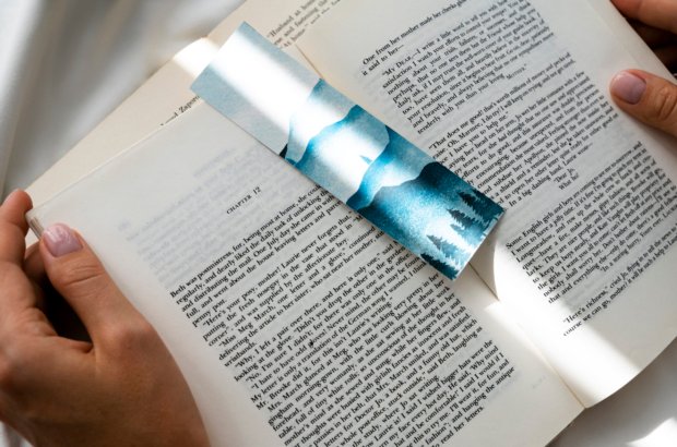 top-view-hands-holding-book